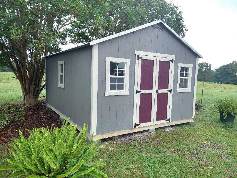 Shed with metal roof and accent color on the door